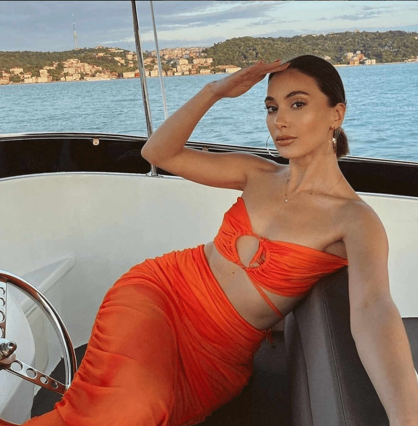 Orange ruched mesh halter midi set with criss-cross neckline from Chez Neeba.