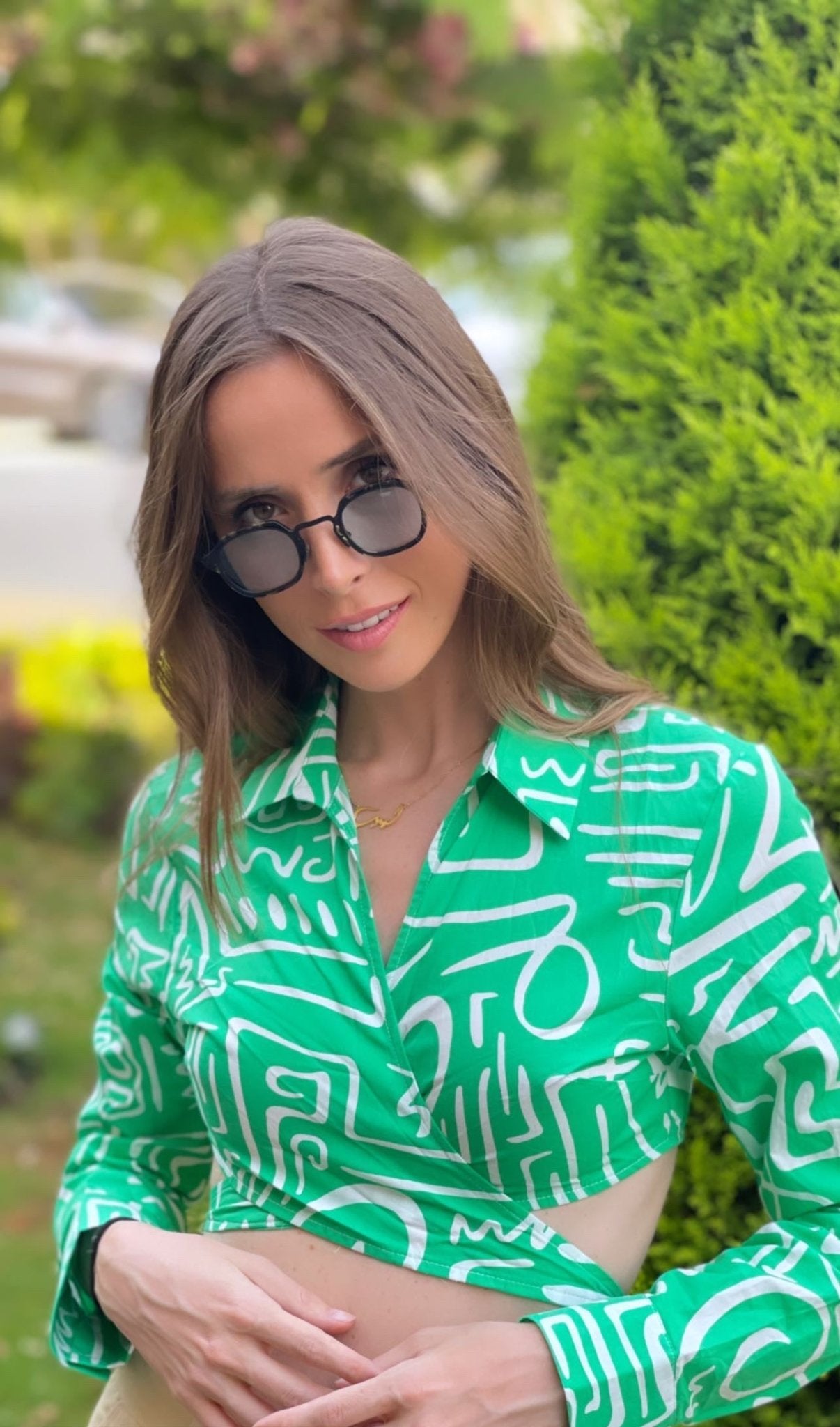 Green cropped button-up shirt with white abstract print from Chez Neeba.