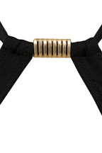 Black ribbon with a gold metal clip on a white background