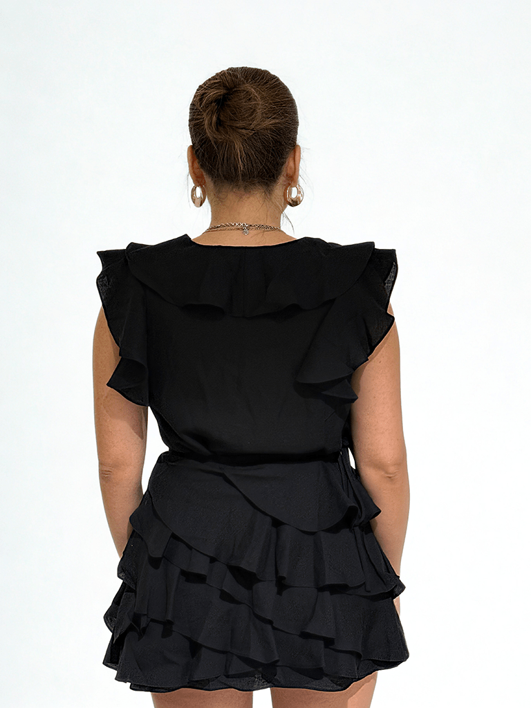 Black ruffle mini set by Chez Neeba, sleeveless top and layered mini skirt, limited edition Dubai women’s fashion.