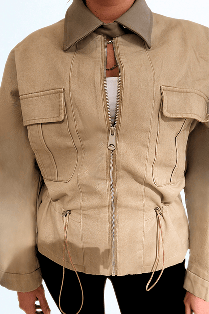 Desert Dusk Jacket by Chez Neeba — elegant neutral jacket featuring a darker olive leather collar, structured tailoring, and soft textured fabric inspired by desert tones for a refined minimalist look.