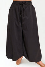 The Flow Pants by Chez Neeba — wide-leg trousers in soft lightweight fabric, designed for comfort and effortless movement, limited edition Dubai fashion.