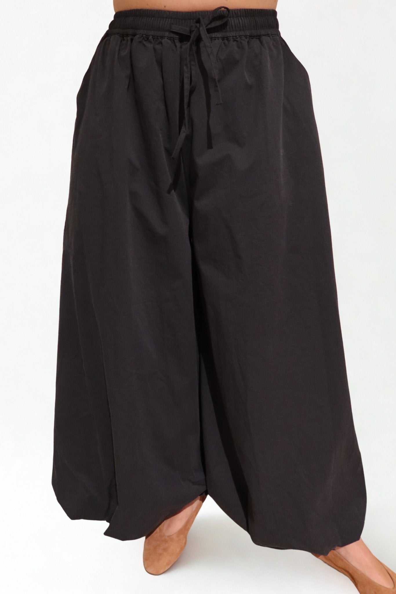 The Flow Pants by Chez Neeba — wide-leg trousers in soft lightweight fabric, designed for comfort and effortless movement, limited edition Dubai fashion.