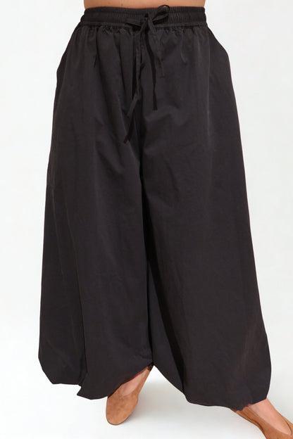 The Flow Pants by Chez Neeba — wide-leg trousers in soft lightweight fabric, designed for comfort and effortless movement, limited edition Dubai fashion.