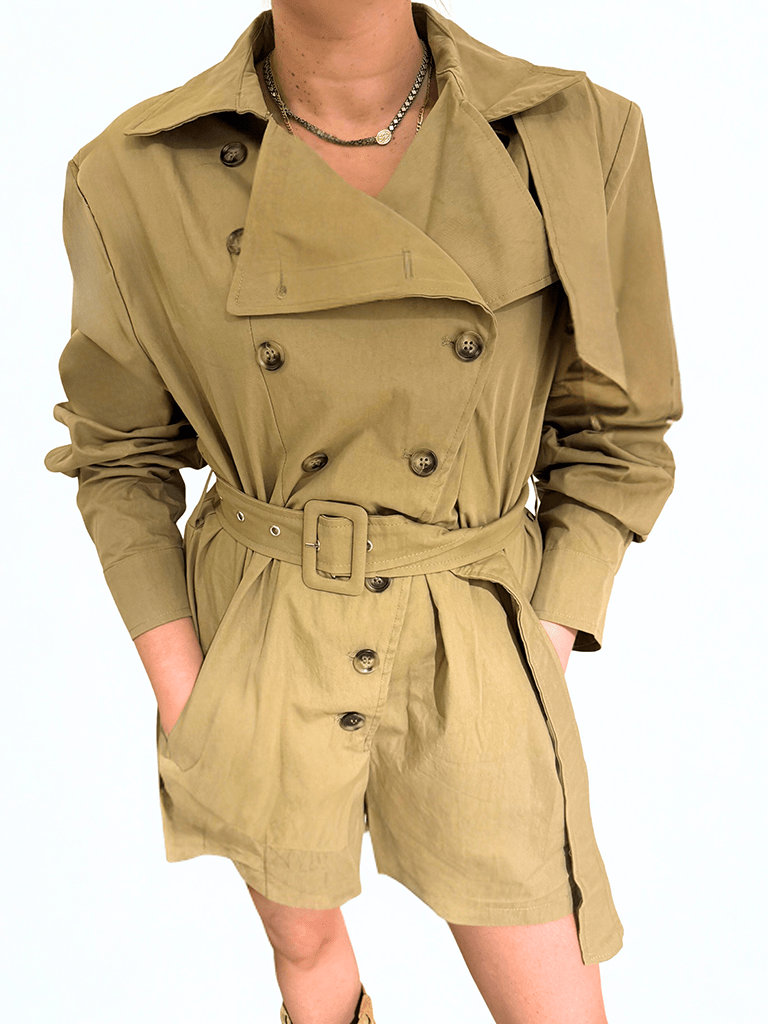 The Sahara Trench Romper by Chez Neeba — beige short trench-style romper with button closure and belt detail, limited edition women’s fashion from Dubai.