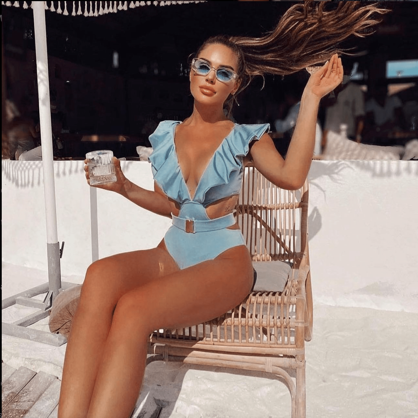 Sky-blue ruffled one-piece swimsuit with cutout waist from Chez Neeba.