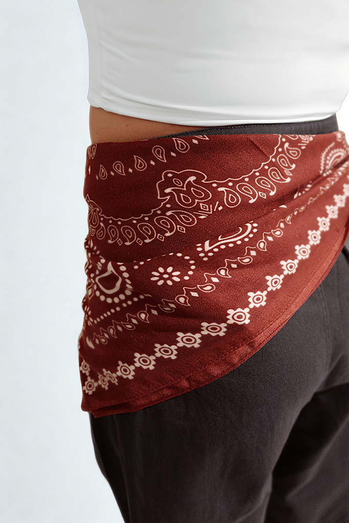 The Desert Bandana Wrap by Chez Neeba — rust-toned waist scarf with cream print, heritage-inspired limited edition accessory from Dubai.