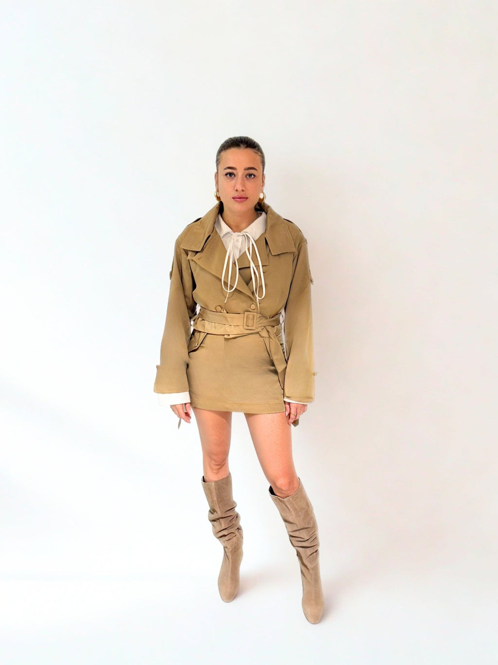 Cropped trench jacket and mini skirt set by Chez Neeba, beige and black tones, limited edition Dubai fashion.