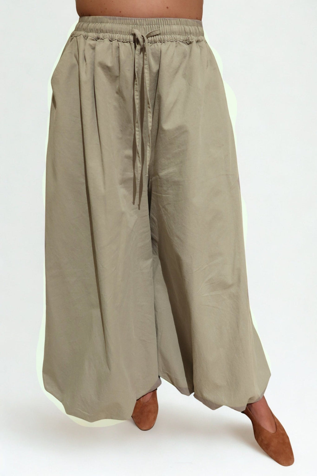 The Flow Pants by Chez Neeba — wide-leg trousers in soft lightweight fabric, designed for comfort and effortless movement, limited edition Dubai fashion.