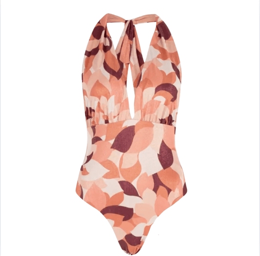 Printed halter one-piece swimsuit in peach and brown tones by Chez Neeba.