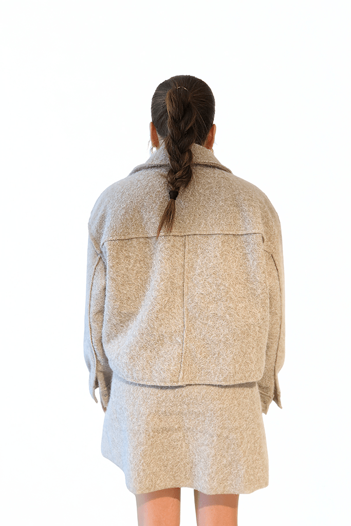 The Sandstone Wool Set by Chez Neeba — beige wool two-piece with cropped jacket and mini skirt, limited edition women’s fashion from Dubai.