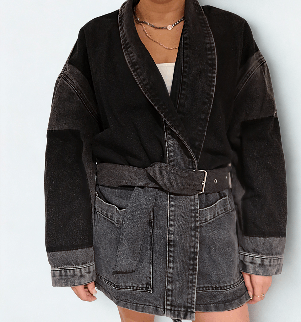The Wrap Jacket by Chez Neeba — stylish denim jacket in shades of grey and black, featuring a wrap design with a belt that can be buckled or tied for a versatile, structured yet relaxed silhouette.